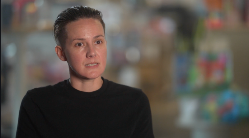 Julie M looking into the camera during an interview