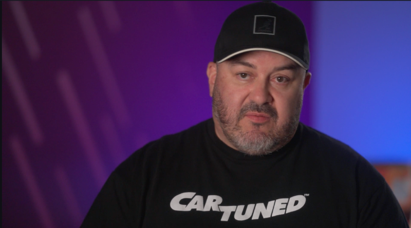 Luis T looking into the camera during an interview